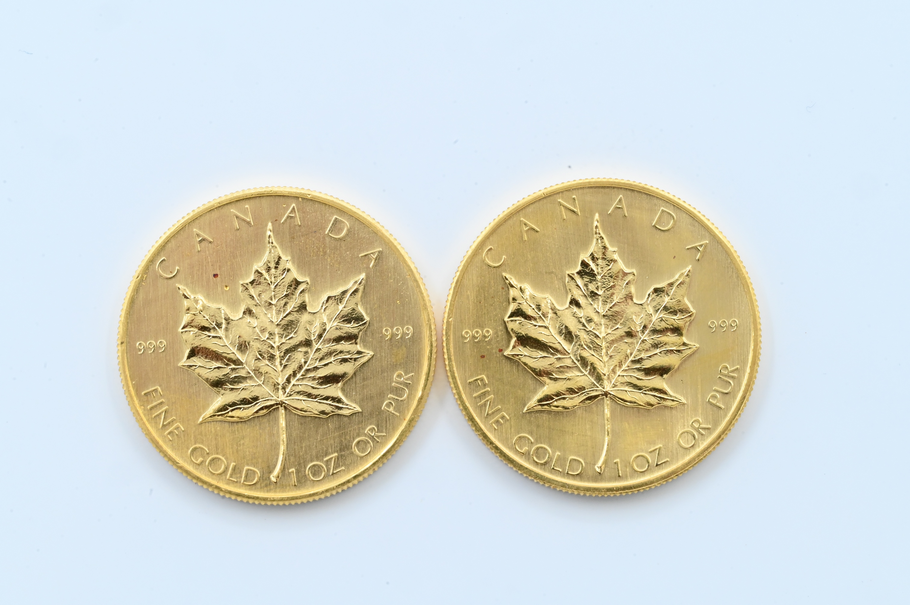 Two Canadian Maple Leaf Ounce Gold Coins