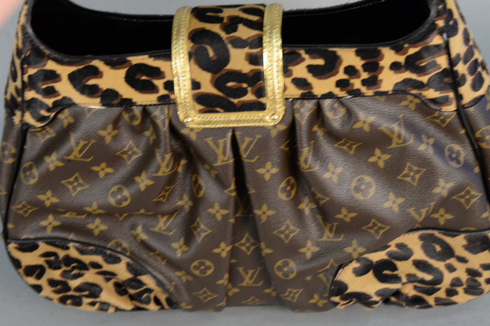 Lot 52: Louis Vuitton leopard print monogram handbag, 'Polly Leo